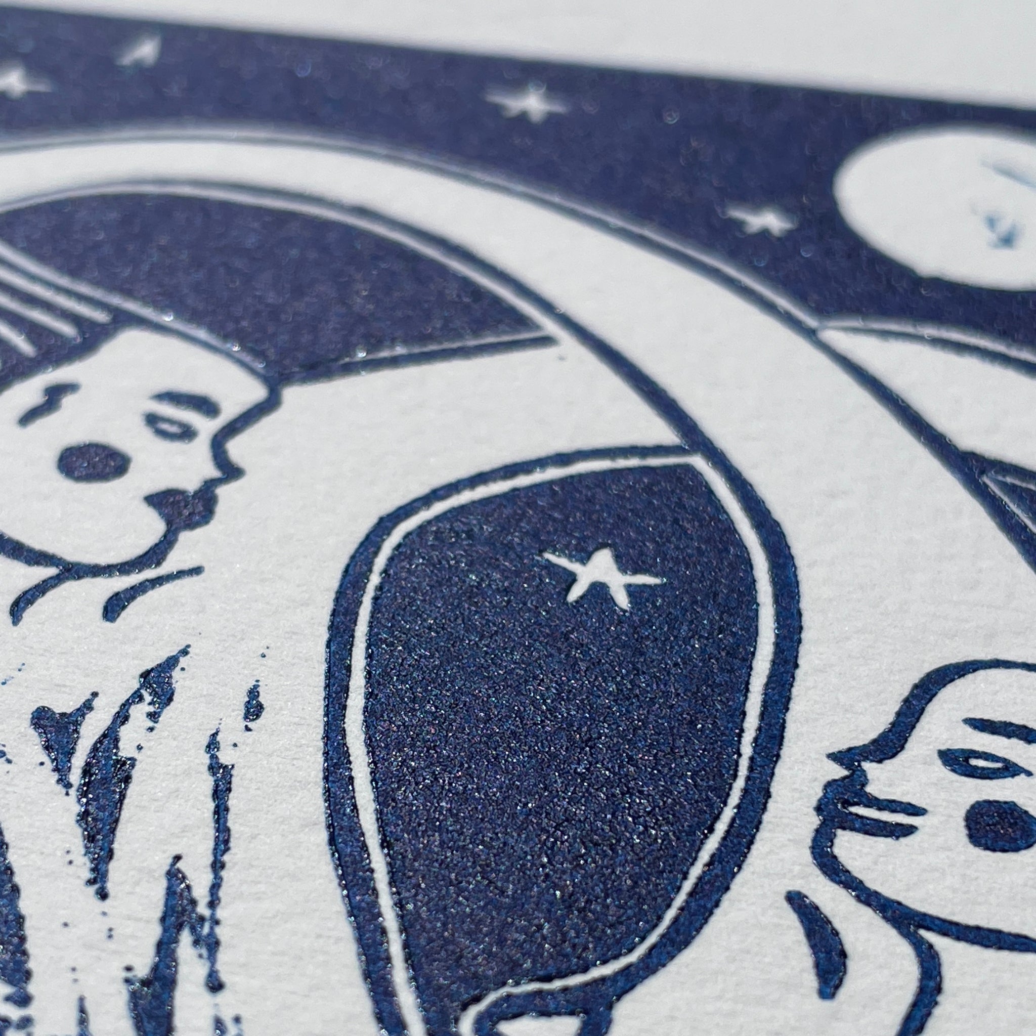 Close-up of a blue and white illustration with abstract shapes and faces.