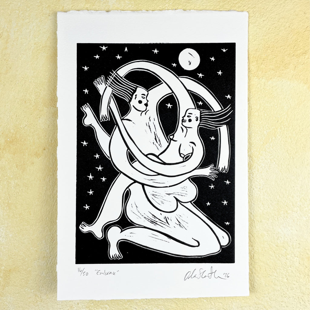Black linocut "Embrace", two figures tenderly holding each other in a fluid, harmonic hug