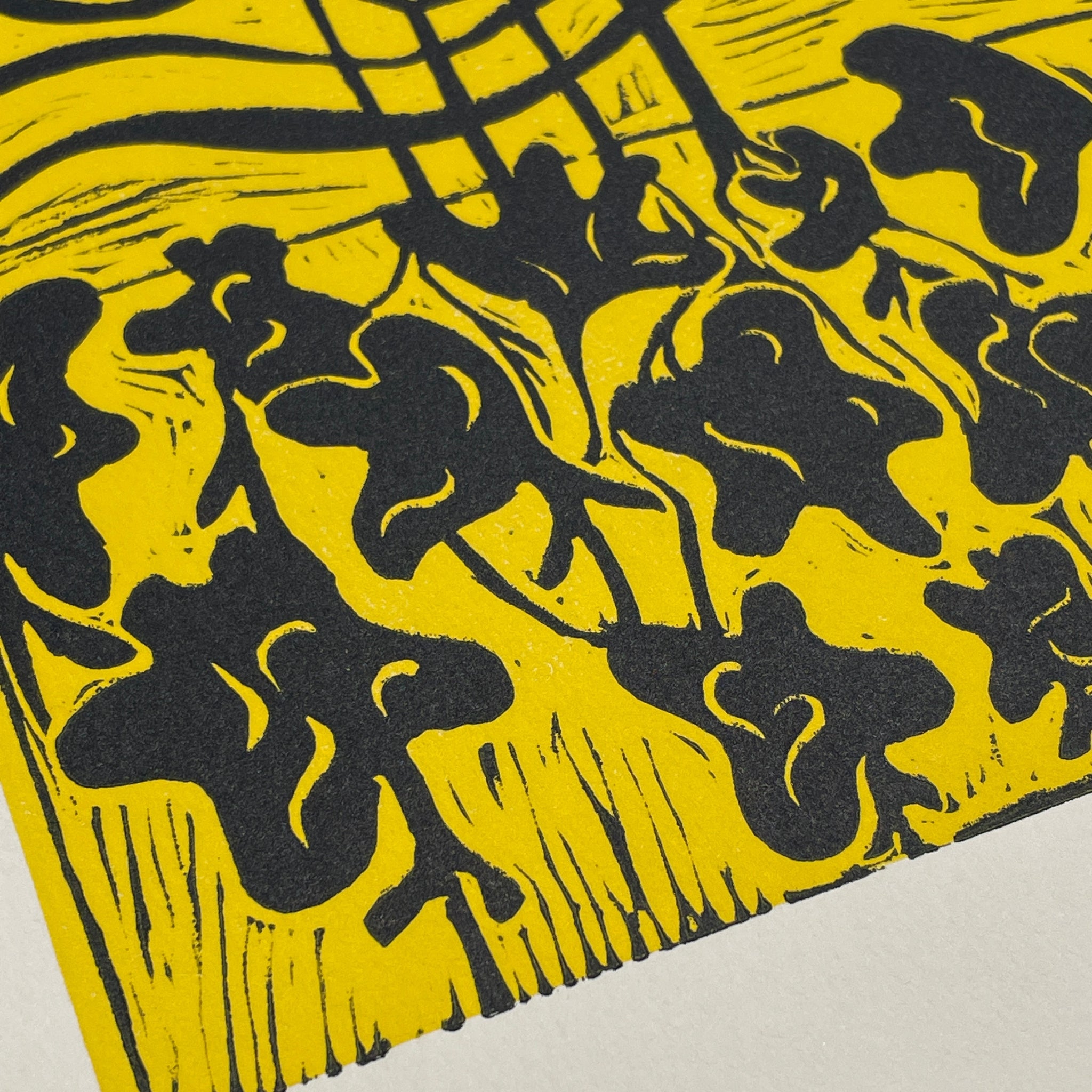 Black floral patterns on a yellow background