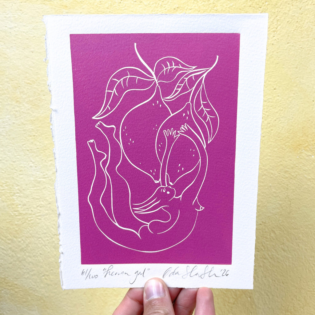 Pink linocut "Lemon Gal", a fairy-like woman draped among lemons on a tree