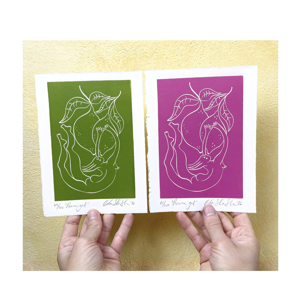 Two prints, one green and one pink, held by hands against a cream background.