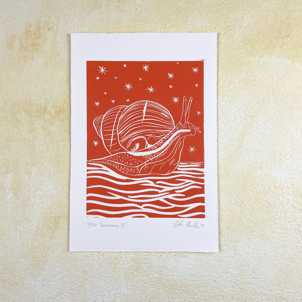Orange print of a snail illustration on a background with wavy lines and stars, mounted on a textured beige wall.