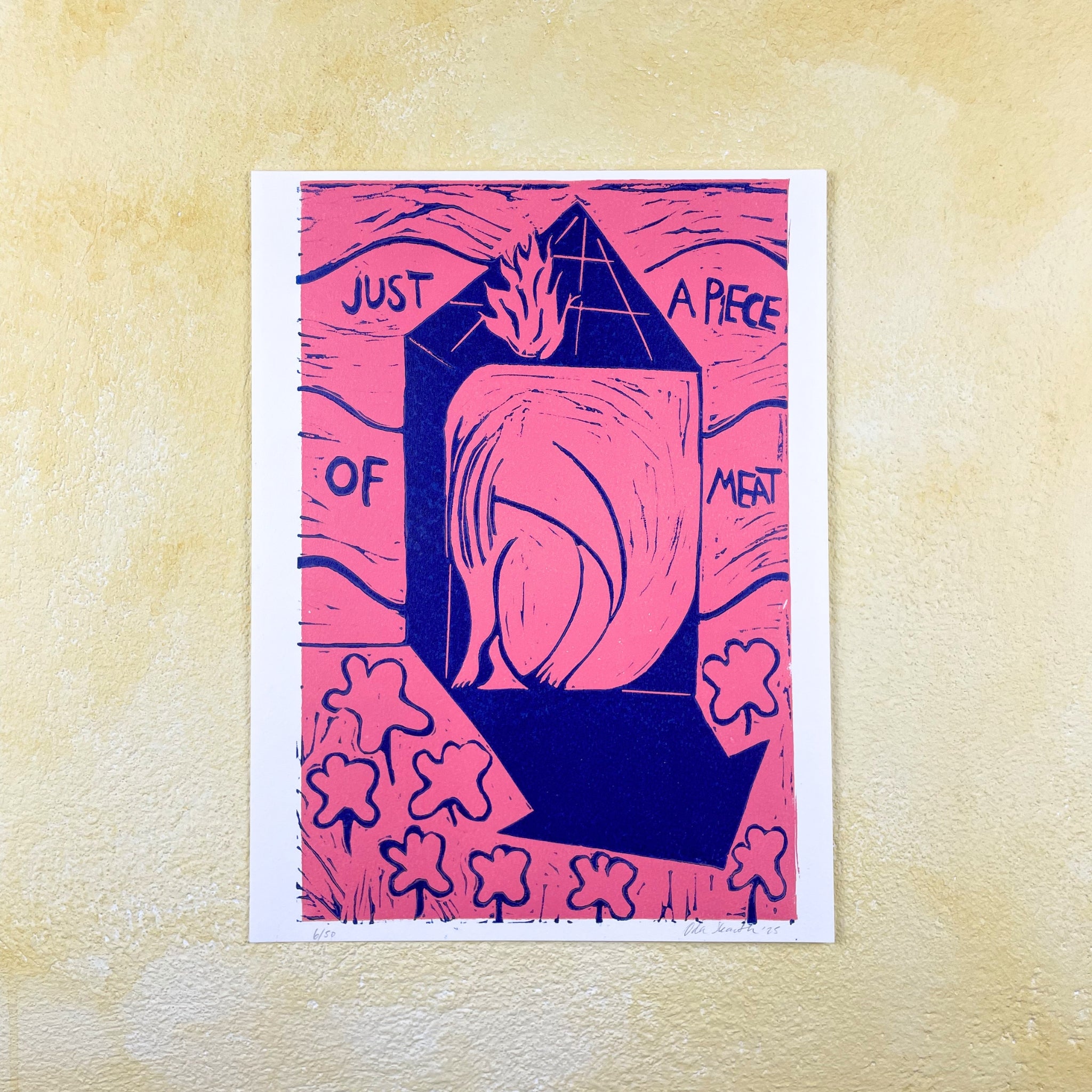 Pink and blue linocut "Just a Piece of Meat", a woman filling a tiny house with title text on a textured faded yellow wall