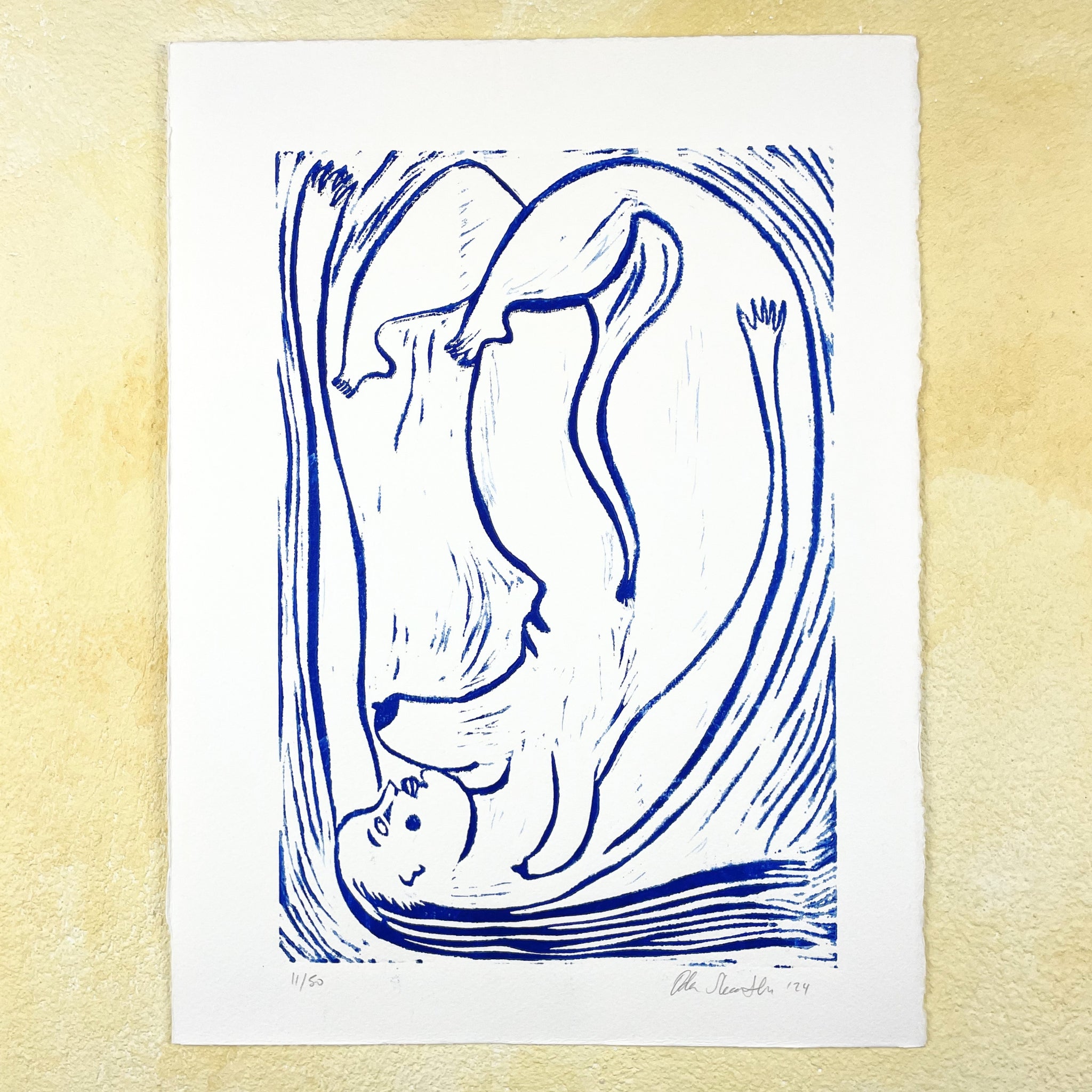 Blue figurative linocut "Trapped in the Format", a falling woman stretching edge to edge