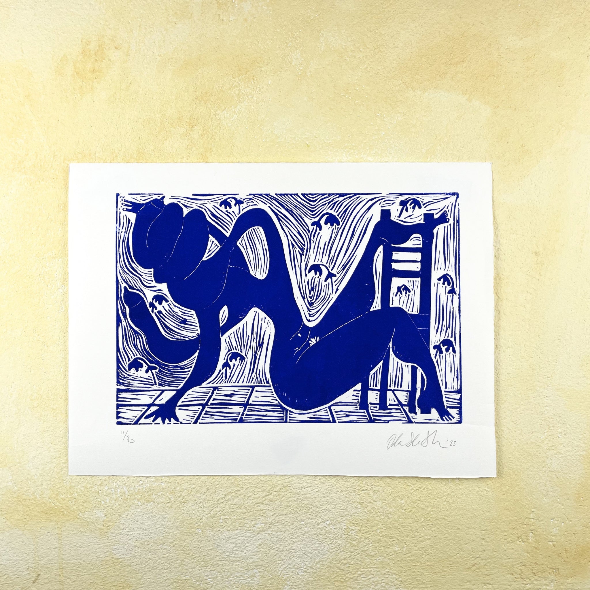 Ultramarine blue figurative linocut "Twisted" of a nude body turning in a room with a chair