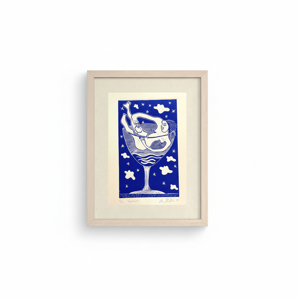 Framed artwork of a blue and white design on a white background